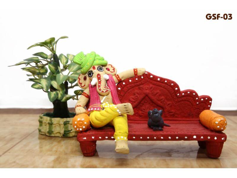 Terracotta Ganesh Sitting on Sofa (Height: 5 Inch, Width: 7 Inch)