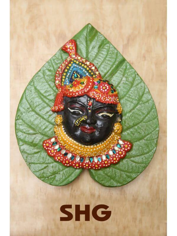 Terracotta Shri Nath Ji on Leaf (Height: 8 Inch, Width: 6 Inch)